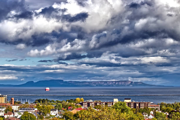 istock Cloudy drama in grey over the Sleeping giant with the lone grain ship - Thunder Bay, ON, Canada 1372829929