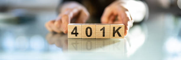 istock Woman With 401K Blocks 1372831615