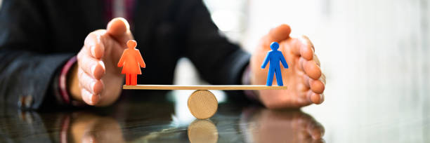 istock Equal Gender Seesaw Balance 1372833353