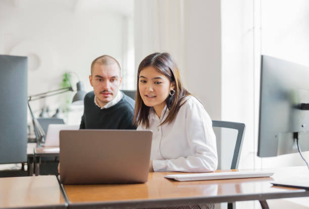 istock Office colleagues working together in office 1372834506