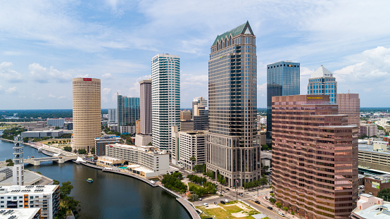Aerial view of Downtown Tampa Skyline over the Hillsborough River on a summer day.