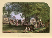 istock Villagers dancing, playing, under the old oak tree, Traditional English scene, Victorian, 19th Century 1372835890