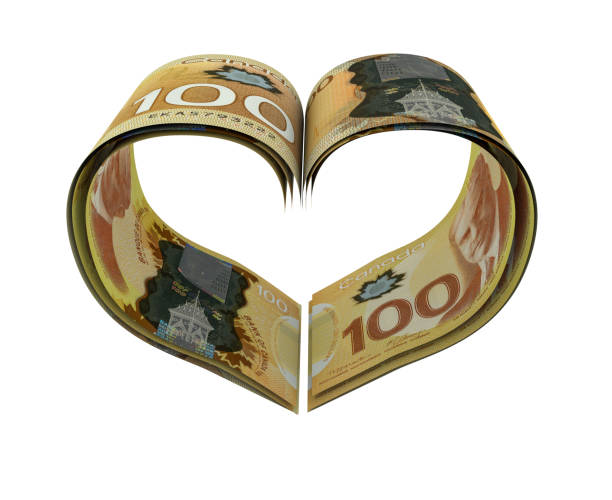 Heart Shape Made Canadian Dollars Heart Shape Made Canadian Dollars canadian coin stock pictures, royalty-free photos & images