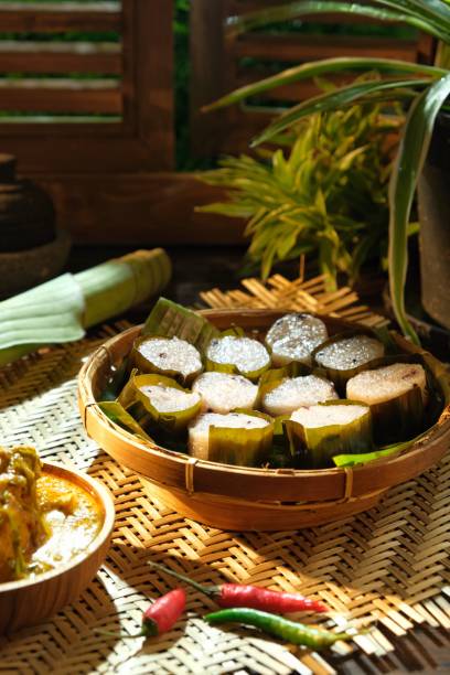 Lemang and chicken rendang During the fasting month,array of Malay tradition food like lemang and chicken rendang and serunding are commonly eaten together. traditional malaysian food stock pictures, royalty-free photos & images