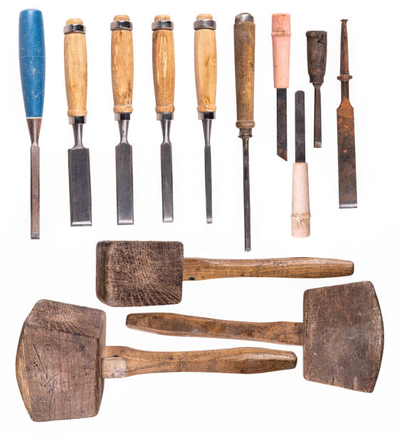 istock Various types of carpentry chisels and a wooden mallet. 1372840807