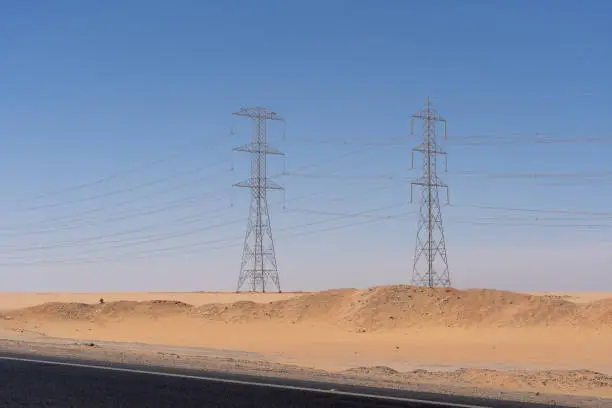 Asphalt road along sand dunes in desert, Sahara, Egypt, Africa