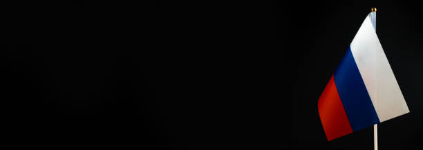 istock Russian flag on black background. Copy space 1372842611