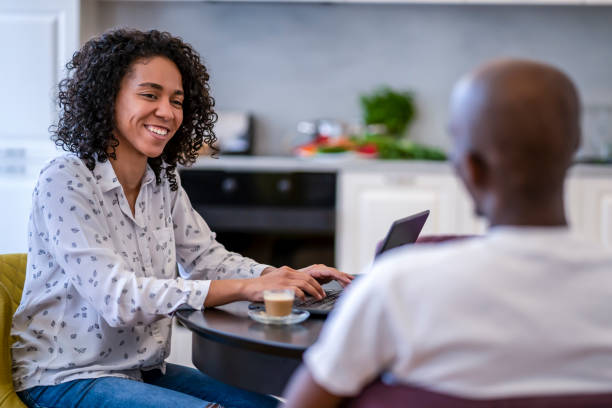 istock Afro couple at home talking to each other. 1372845562
