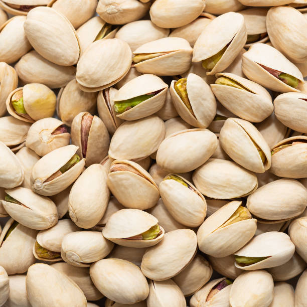 istock Pistachio nut seeds with shell isolated 1372849301