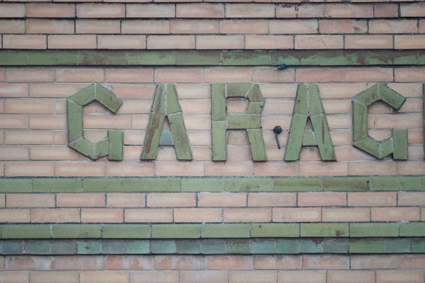 istock Brick sign built into old building wall with colored bricks 1372855725