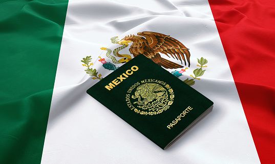 Mexican passport on the top of satin flag