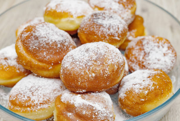 istock Freshly made Doughnuts iced with sugar and served on a table 1372861528