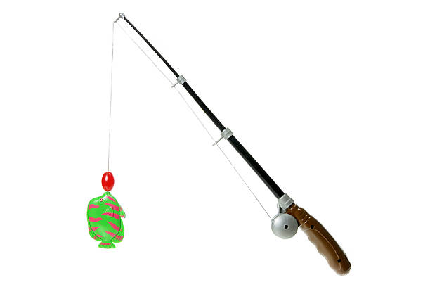Toy Fishing Rod Toy Fishing Rod on White Background fishing rod photos stock pictures, royalty-free photos & images