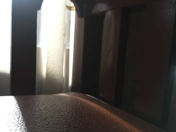 istock Background picture sun shine through window and wooden couch 1372870101