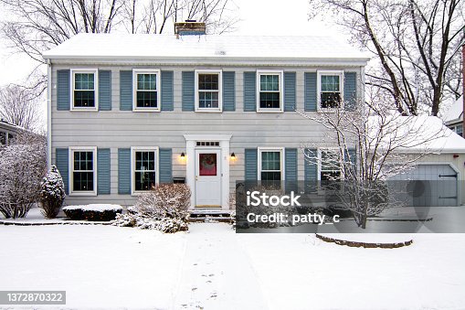 istock Saltbox Colonial House in Winter 1372870322