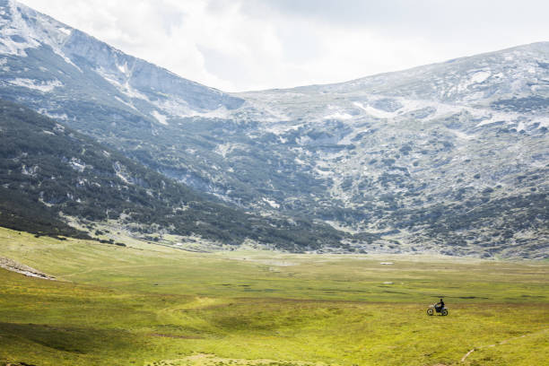 istock motocross on a field in the mountains 1372874745