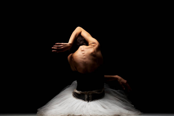 istock ballerina with a tutu posing on the floor 1372874762