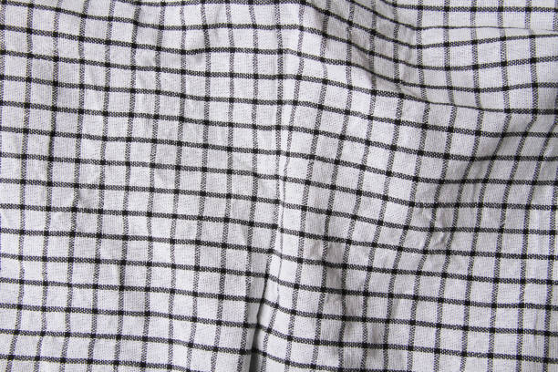 istock Plaid material. Towel on the table. Wrinkled fabric with stripes. 1372875942