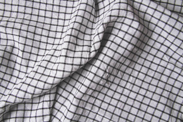 istock Plaid material. Towel on the table. Wrinkled fabric with stripes. 1372876466
