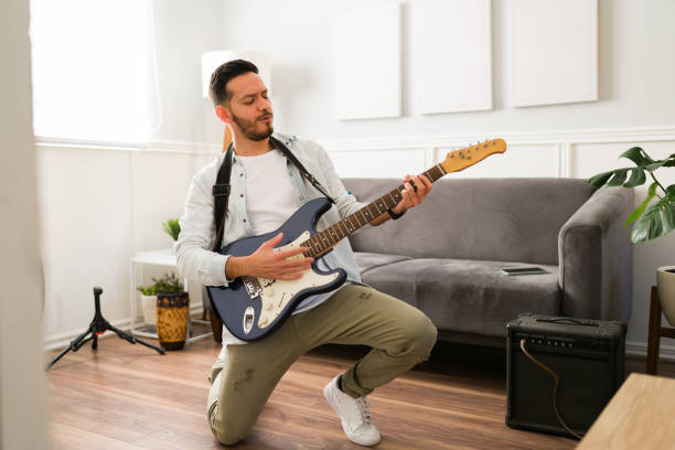 istock Passionate guitarist playing rock music 1372878694