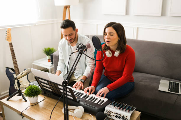 istock Attractive singer playing the piano 1372878750