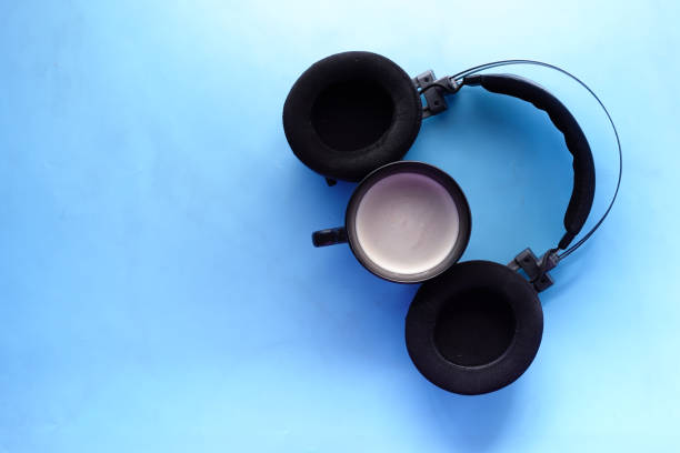istock coffee and wireless headphones on blue background 1372879305