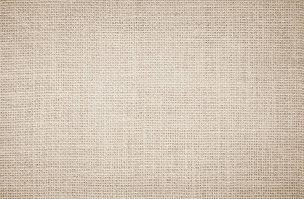 istock Jute hessian sackcloth burlap canvas woven texture background pattern in light beige cream brown color blank. Natural weaving fiber linen and cotton cloth texture as clean empty for decoration. 1372882645