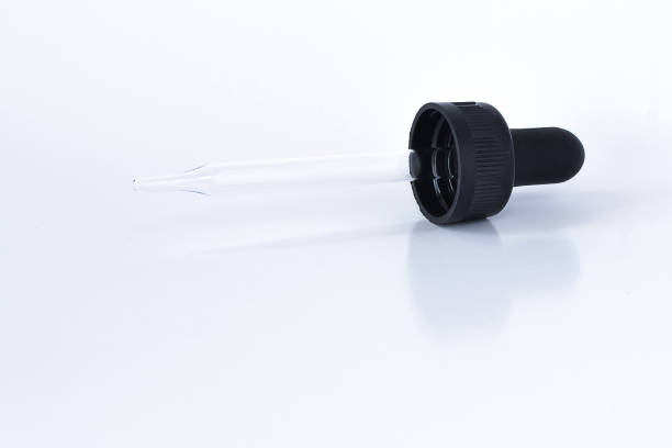 istock Clear glass dropper pipette on white background 1372887576