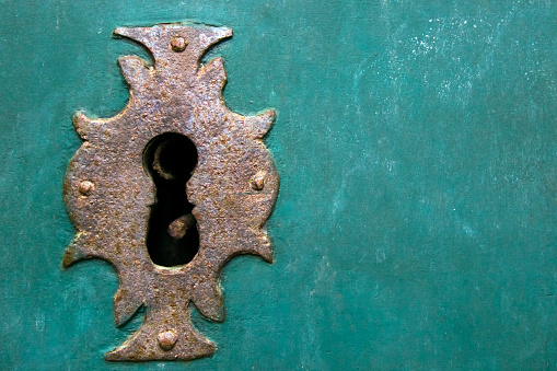 Old wooden door and ancient lock keyhole .Colegiata Santa María a Real do Sar church . Santiago de Compostela,  Galicia, Spain.