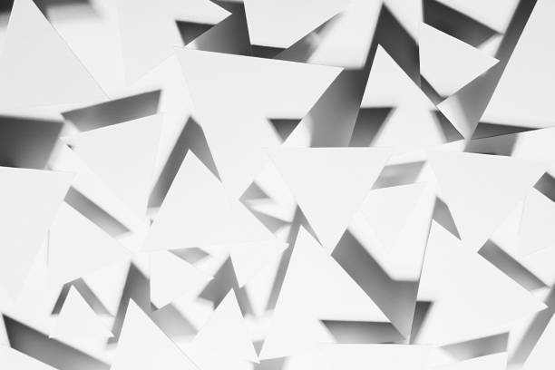 istock White paper triangles as energy cocky abstract random pattern in bright light with black strict shadows, sharp angles, top view. Contemporary simple abstract background. 1372898914