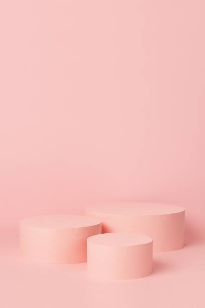 istock Elegant set of three pastel pink circle podiums mockup on soft light background, copy space, vertical. Template scene for advertising, presentation cosmetic product or goods, design. 1372899424