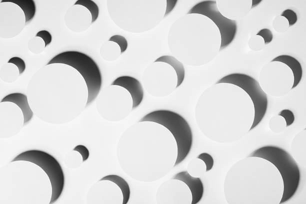 istock White simple geometric background with flying circles in shine hard light with contrast black shadows, glare as energy stable pattern, top view. Futuristic minimal backdrop for advertising, design. 1372899935
