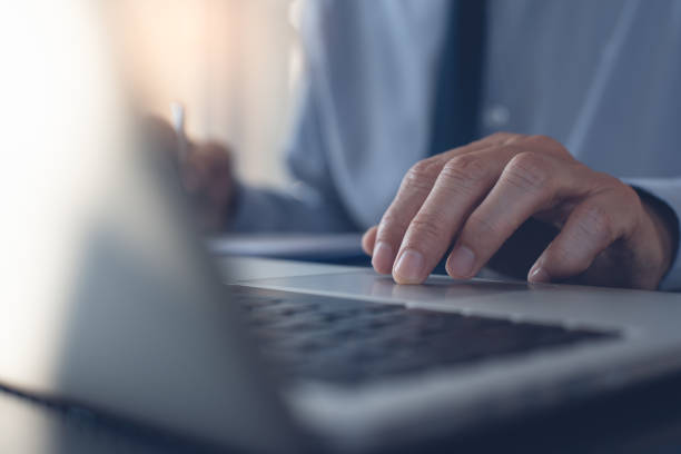 istock Businessman working on laptop in office 1372902373