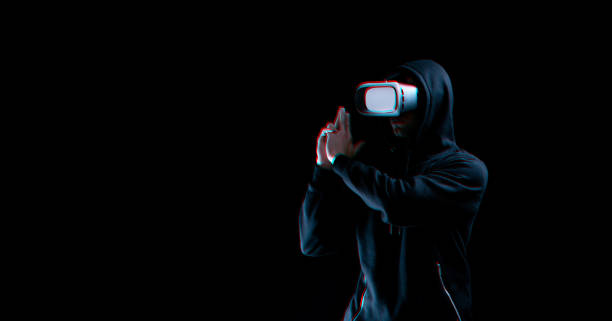 istock Vr glasses virtual reality. Blured young man in digital headset for virtual reality technology on dark background with glitch effect. Amazing technology, online game, entertainment. 1372911240