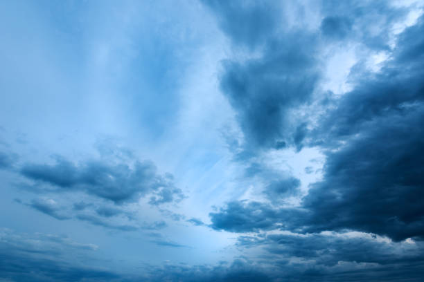 istock Dramatic stormy cumulus clouds at the sky in spring dusk 1372911258