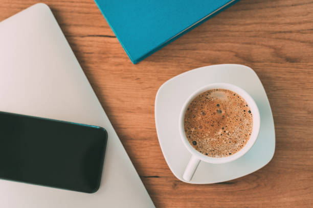 istock Morning coffee before starting the freelance job, top view 1372912072