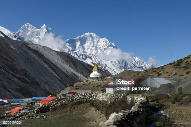 Stupa In The Sherpa Village Dingboche And Snow Covered Mountain Thamserku Stock Photo - Download Image Now