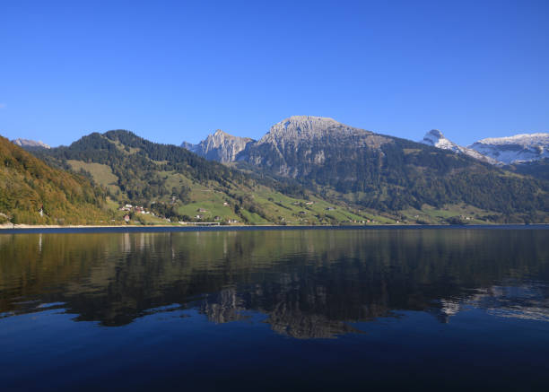 istock Mountain landscape reflecting in Lake Waegital. 1372919484