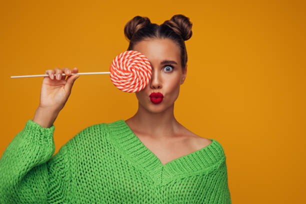 Beautiful woman with big lollipop