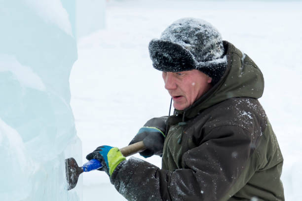 istock Portrait of a sculptor at work with a chisel 1372925473