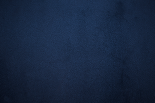 Piel sintética azul oscuro vieja. Fondo. Textura. photo