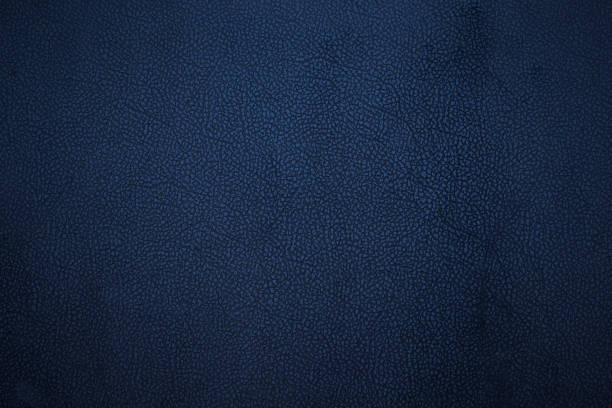 Old dark blue faux leather. Background. Texture. Old dark blue faux leather. Background. Texture. animal skin stock pictures, royalty-free photos & images
