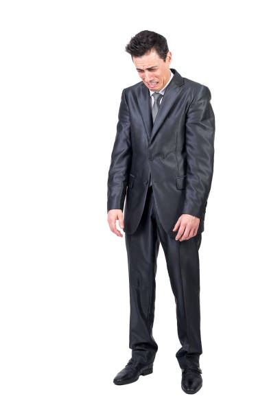 istock Comic businessman in suit crying in studio 1372930151