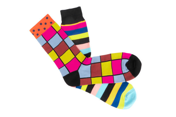 istock Pair socks with different lines isolated on white background. Colorful sock son white background. Colored socks on the leg isolated on white background 1372930564
