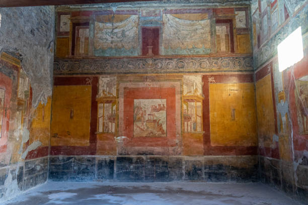 various frescoes or pinturss on walls in the archaeological park of pompeii stock photo