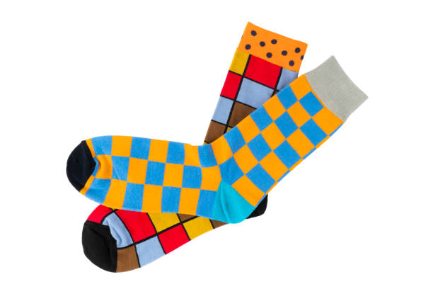 Pair socks with different lines isolated on white background. Colorful sock son white background. Colored socks on the leg isolated on white background