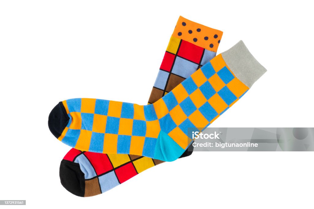 Pair socks with different lines isolated on white background. Colorful sock son white background. Colored socks on the leg isolated on white background Sock Stock Photo