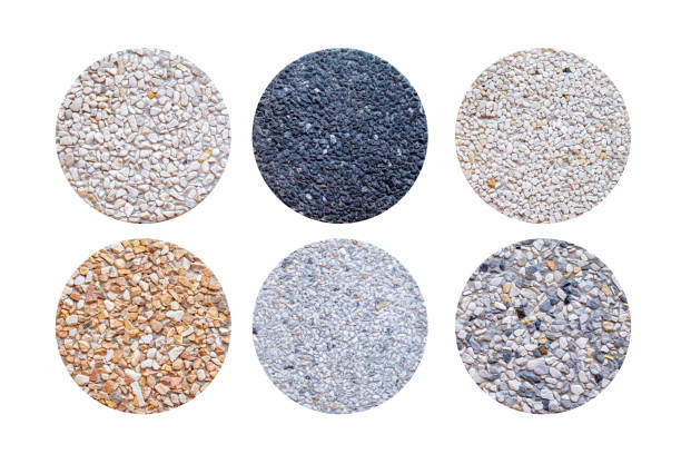 Example of Exposed aggregate concrete with different colored pebbles in close-up stock photo
