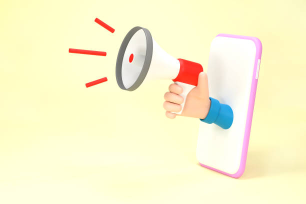 istock Hand holding megaphone coming out from mobile phone. Digital marketing 1372938700