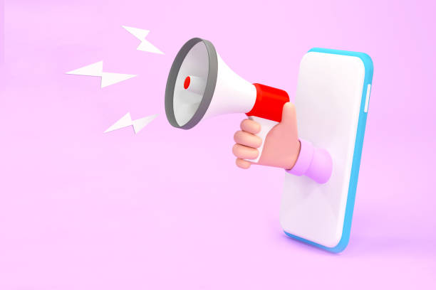 istock Hand holding megaphone coming out from mobile phone. Digital marketing 1372938704